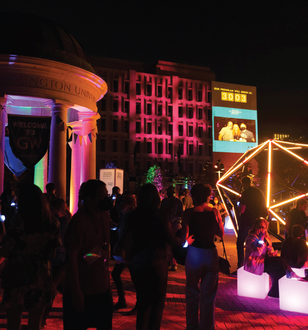 Bicentennial bash showing Kogan Plaza and Tempietto lit up with lights with students and other people walking through the plaza