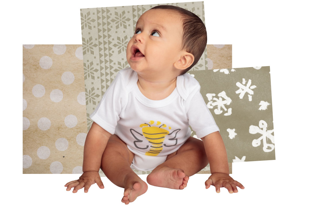 baby wearing bee onsie