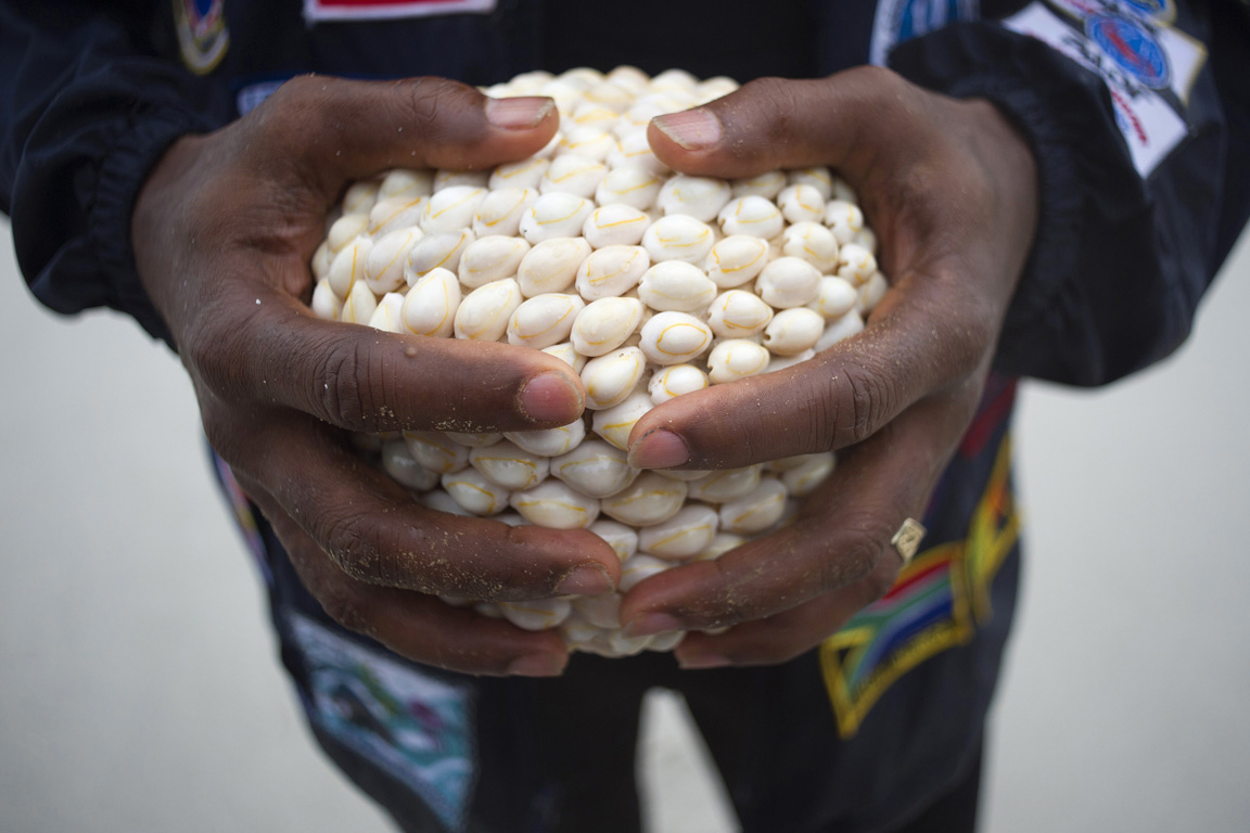 The shell-adorned container filled with soil from Mozambique. (Rodger Bosch/AFP/Getty Images)