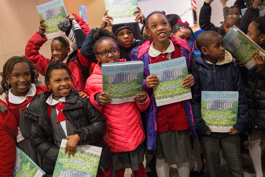 children holding books