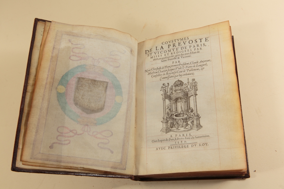 Coustumes de la Prevosté et Vicomté de Paris, 1580: This collection of the “customary” laws of Paris is one of the most important law books in French history and is one of only five printed on vellum and with an