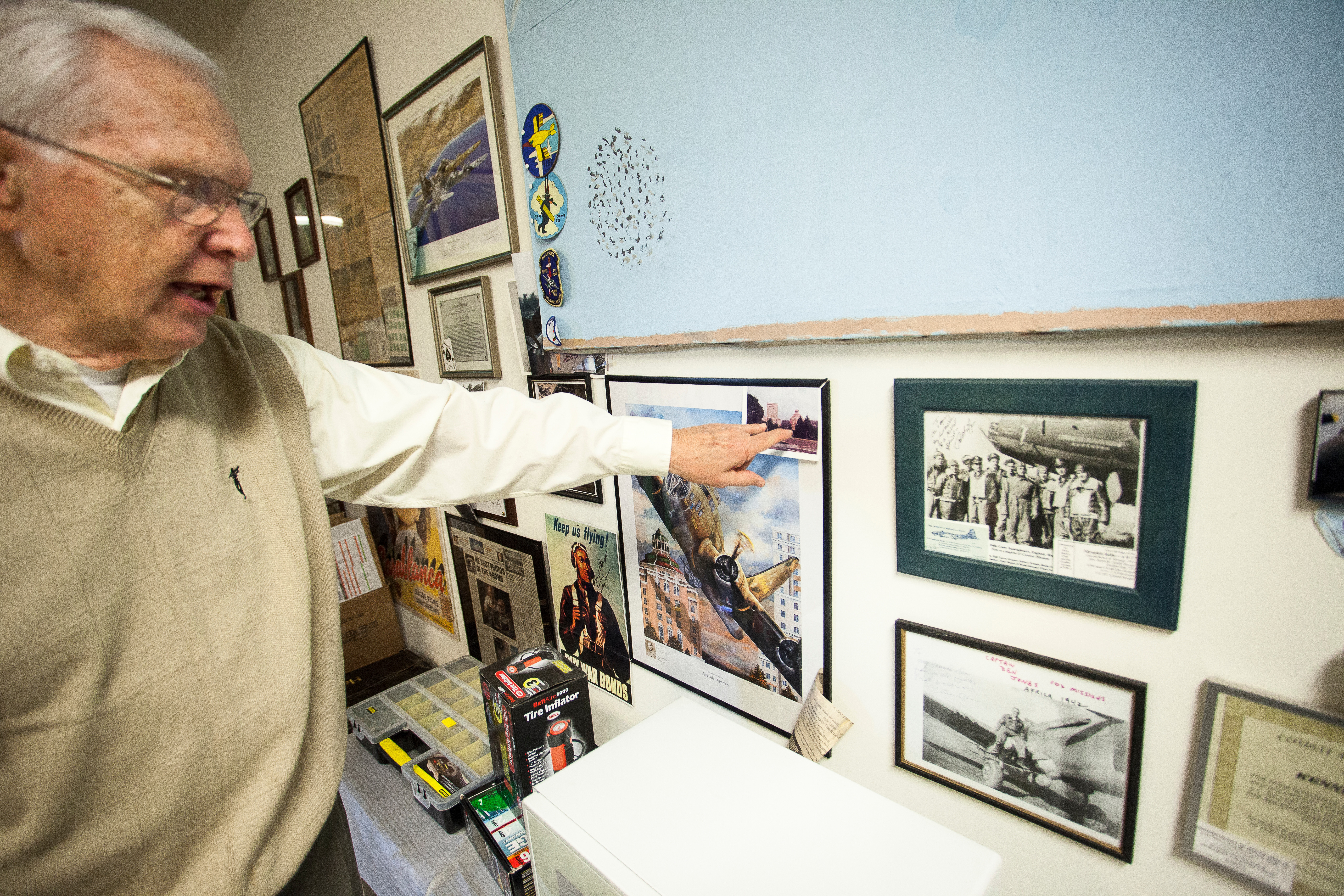 Ken pointing at a picture on the wall