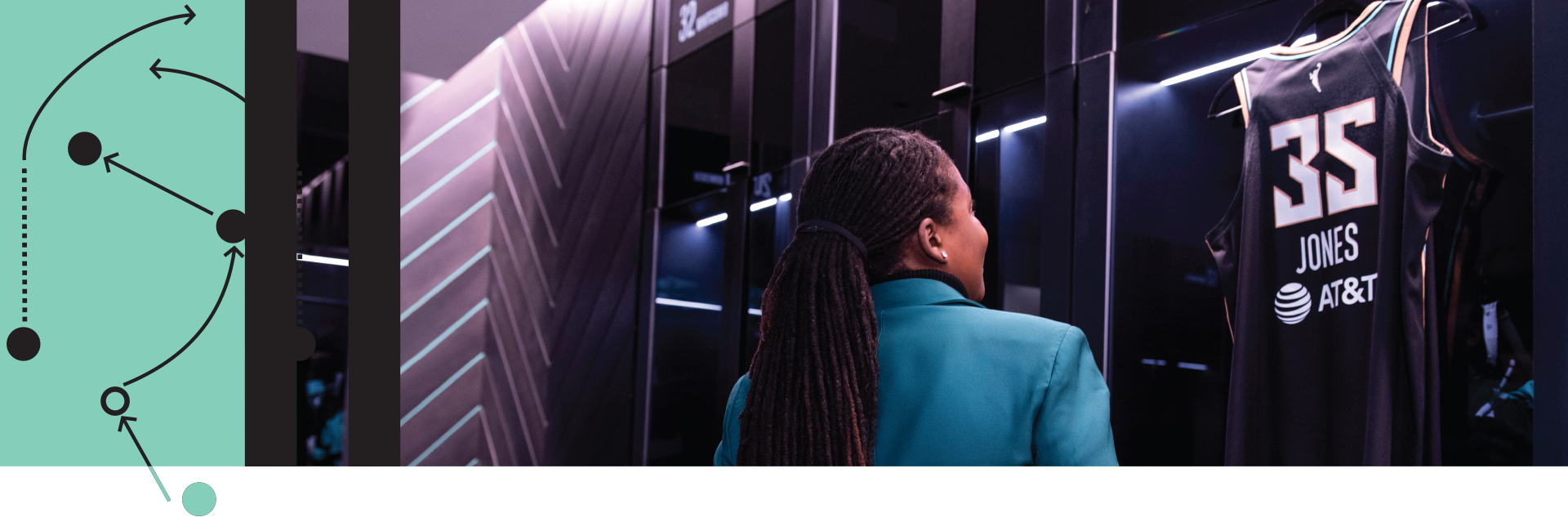 Jonquel Jones looking at her jersey in the New York Liberty locker room
