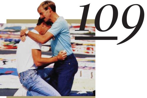 109, Two men hugging at the AIDS Quilt