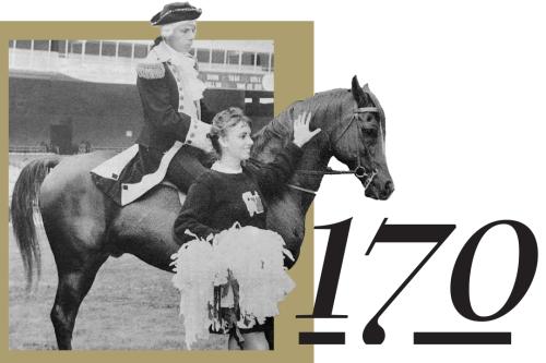 170, A George mascot riding a horse and walking with a cheerleader