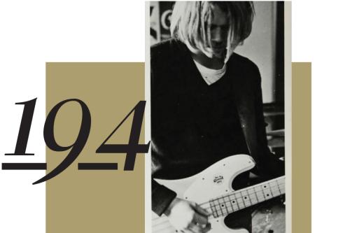 194, A male student with long hair playing the guitar