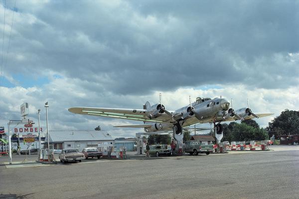 A B-17 Flying Fortress hangs over the Bomber gas station in Milwaukie, Ore