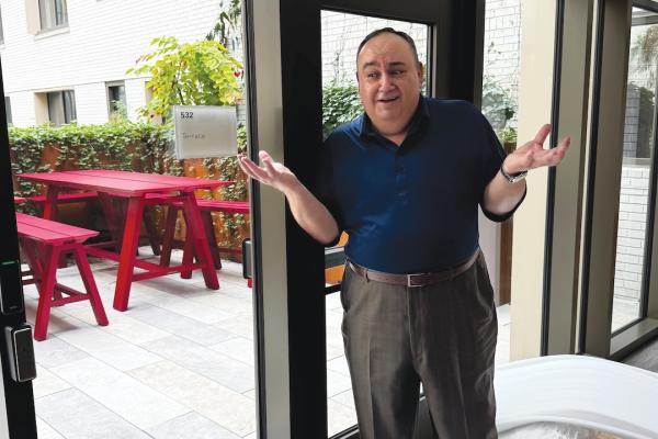 Scott Mory on the terrace of Thurston Hall