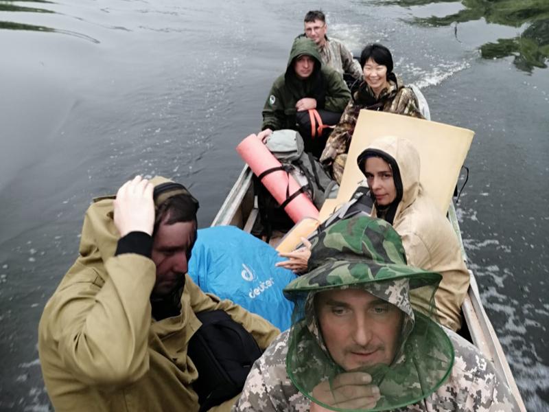 People dressed in jackets in a boat