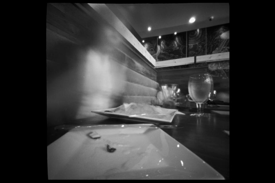 A self portrait of the artist from a series called Square meals: A pinhole diary of eating out.