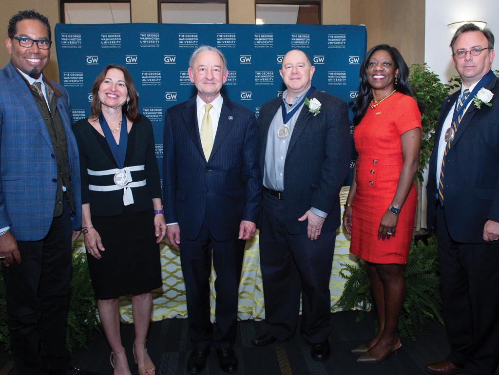 from left: Provost Christopher A. Bracey, Professor Dawn C. Nunziato, President Mark S. Wrighton, Professor Daniel J. Solove, Dean Dayna Bowen Matthew and Professor F. Scott Kieff