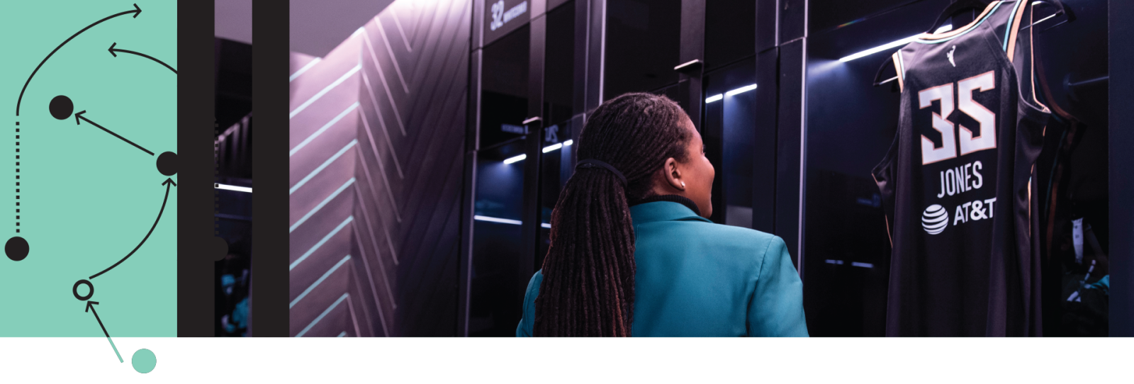 Jonquel Jones looking at her jersey in the New York Liberty locker room